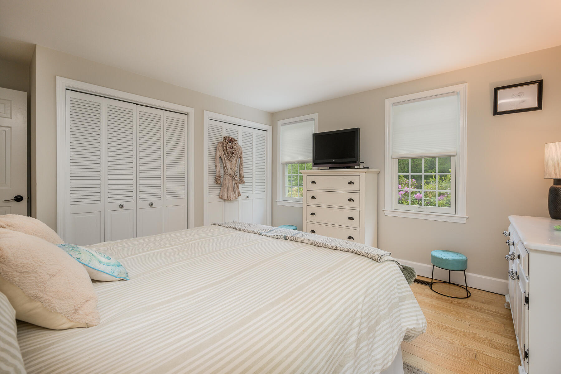 20 Squirrel Run Eastham, MA 02642 - Photo 16 of 37 a bedroom with a bed and a flat screen tv