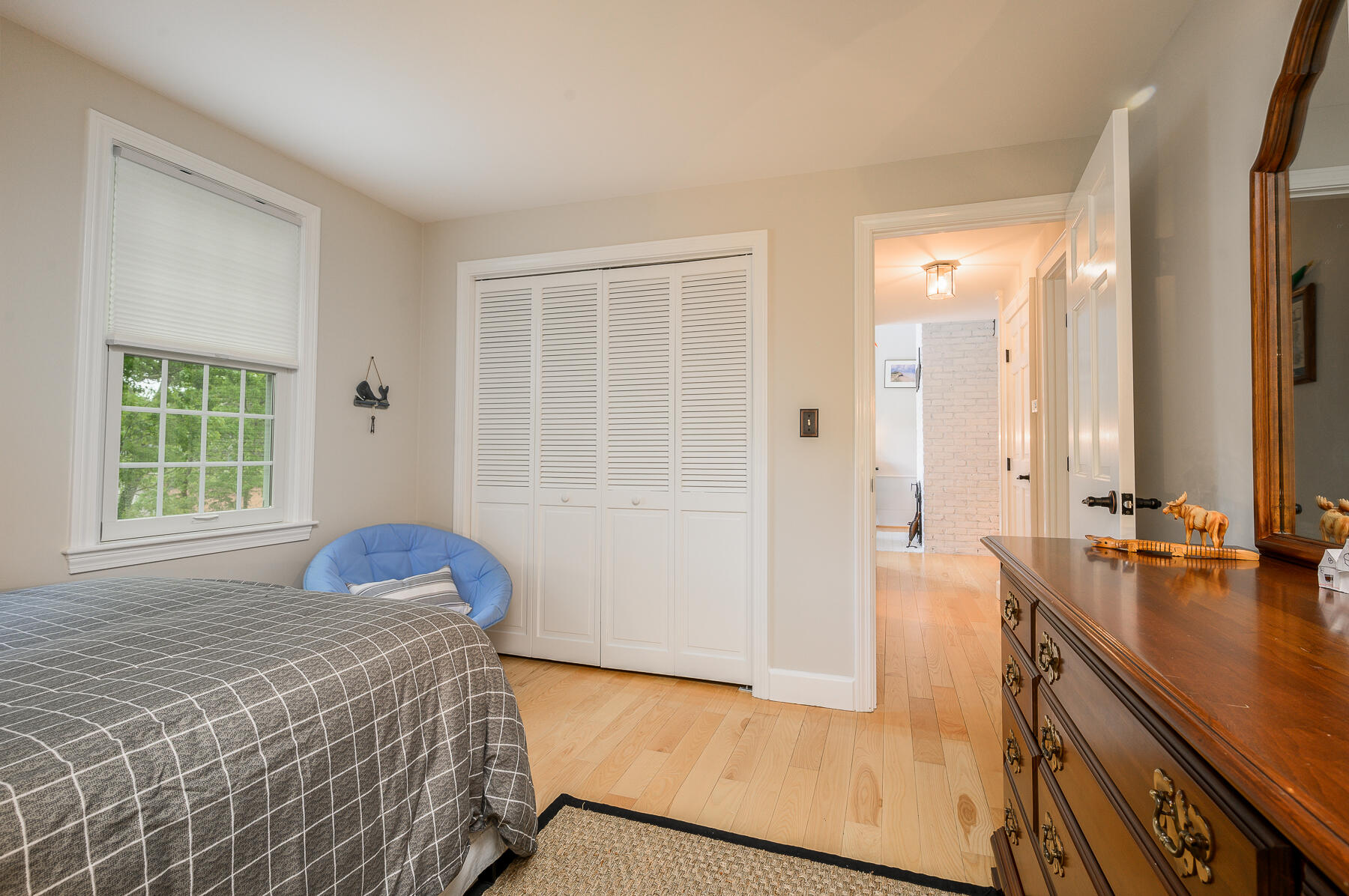 20 Squirrel Run Eastham, MA 02642 - Photo 17 of 37 a bedroom with a bed a dresser and a large window