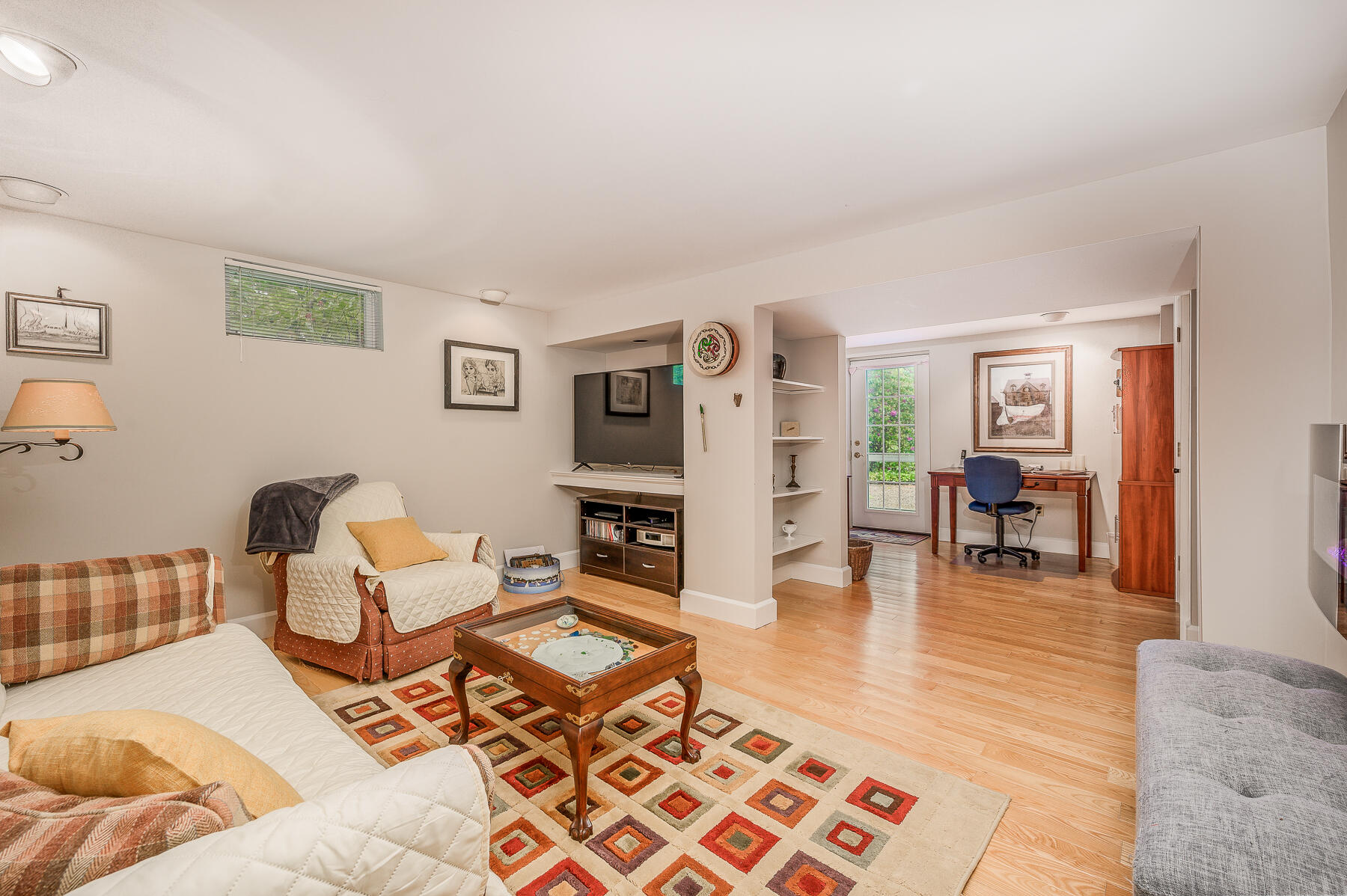 20 Squirrel Run Eastham, MA 02642 - Photo 27 of 37 a living room with furniture and a dining table with wooden floor