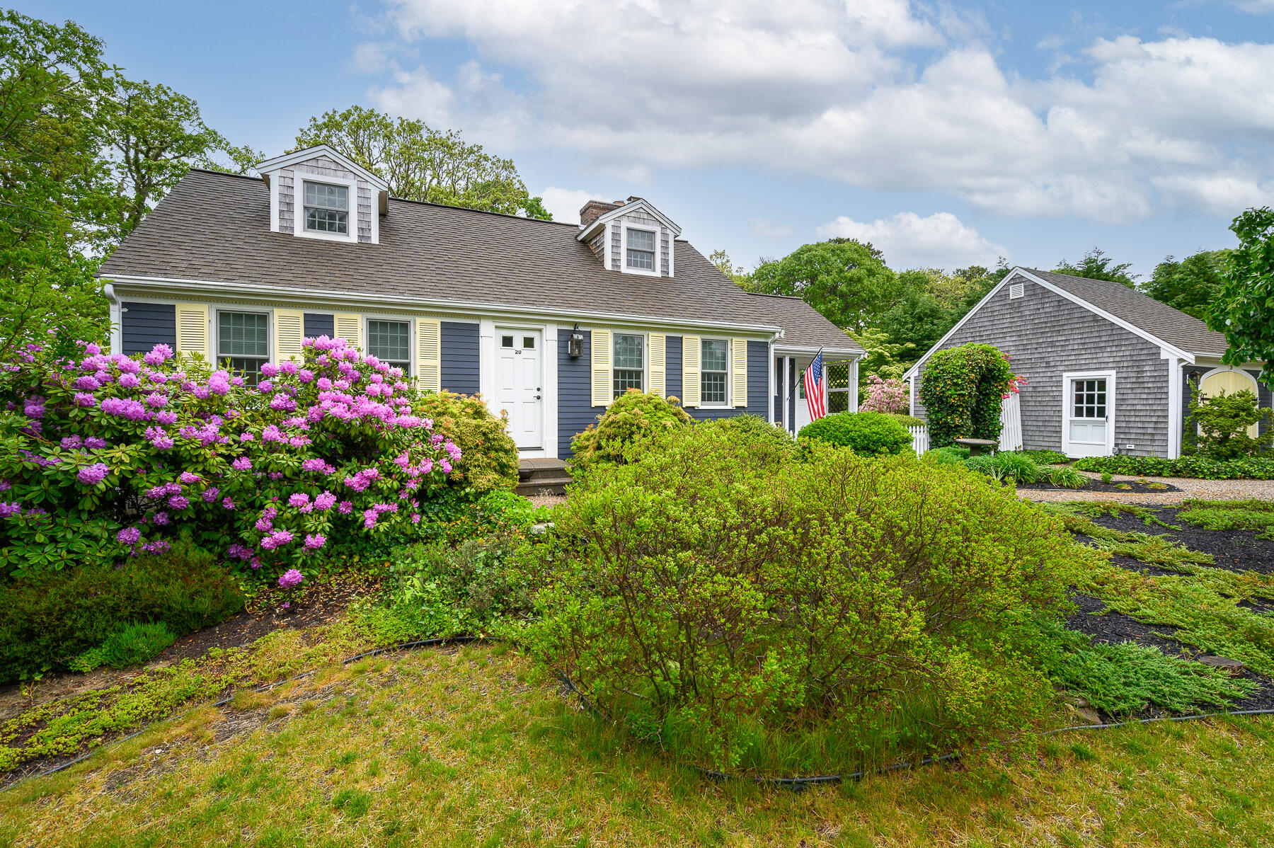 20 Squirrel Run Eastham, MA 02642 - Photo 3 of 37 a front view of a house with a yard