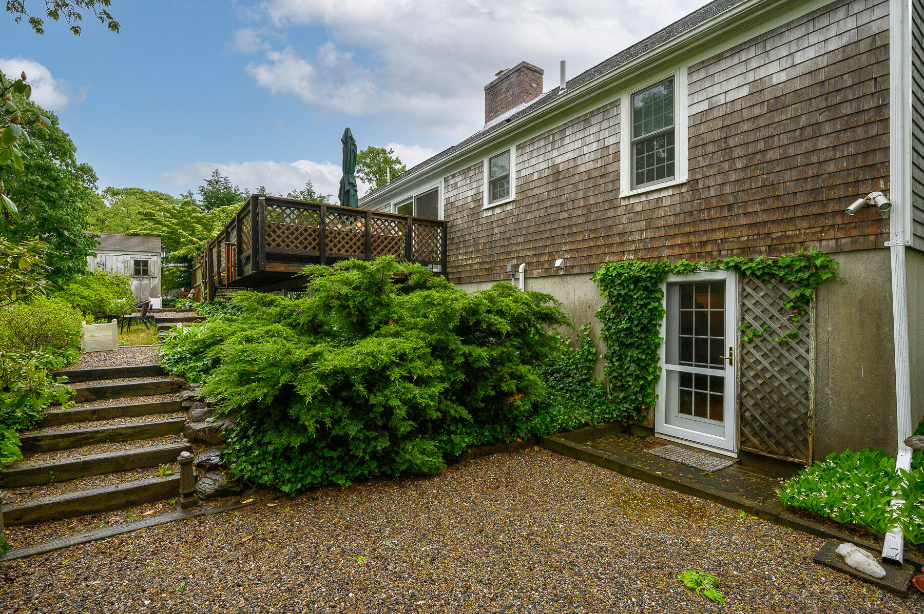 20 Squirrel Run Eastham, MA 02642 - Photo 33 of 37 a view of a house with a yard and plants
