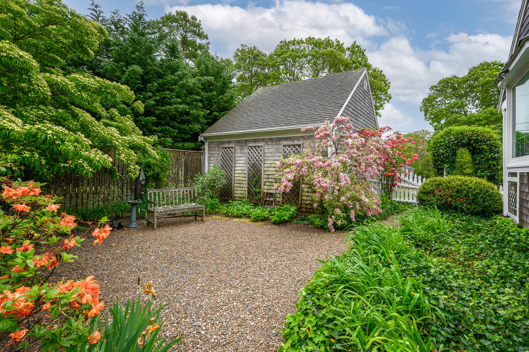 20 Squirrel Run Eastham, MA 02642 - Photo 35 of 37 a view of a house with potted plants and a large tree