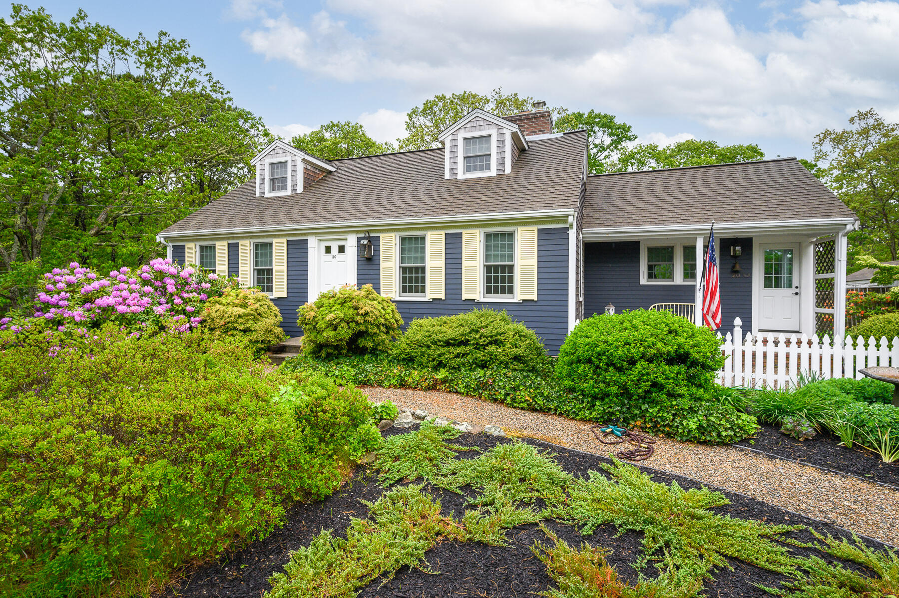 20 Squirrel Run Eastham, MA 02642 - Photo 4 of 37 a front view of a house with a yard