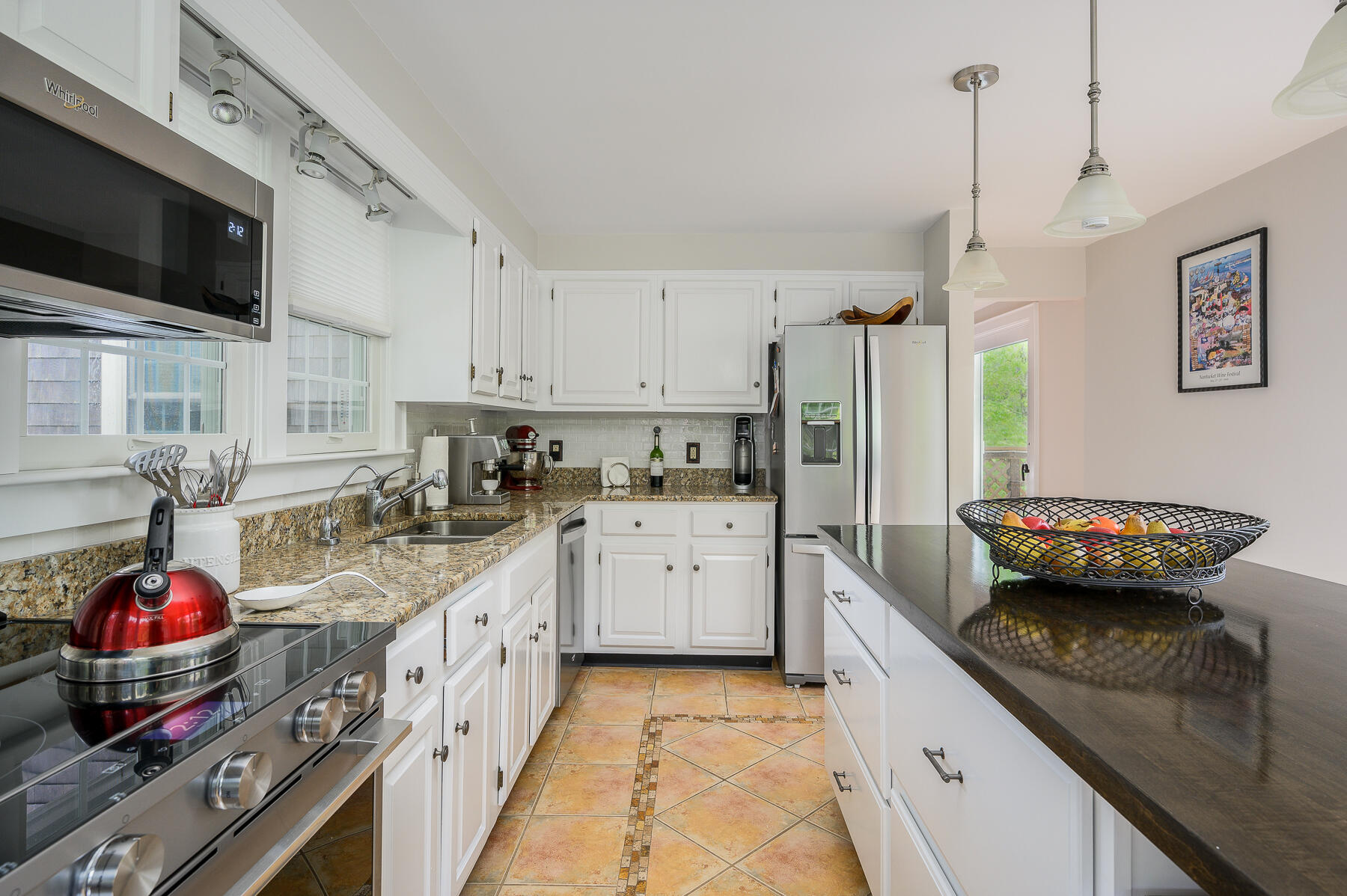 20 Squirrel Run Eastham, MA 02642 - Photo 6 of 37 a kitchen with stainless steel appliances granite countertop a sink and cabinets