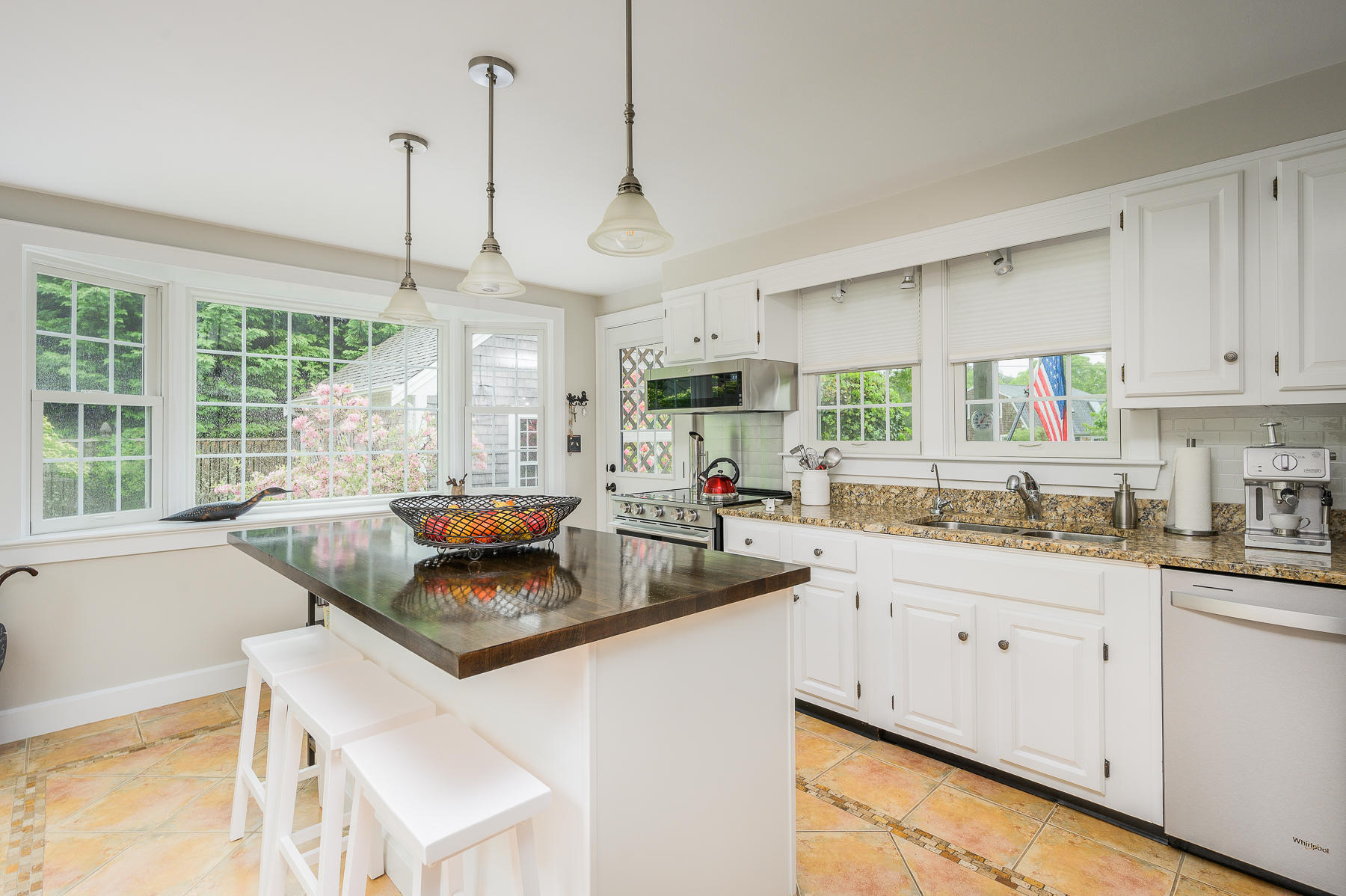 20 Squirrel Run Eastham, MA 02642 - Photo 7 of 37 a kitchen with granite countertop a sink a stove and cabinets