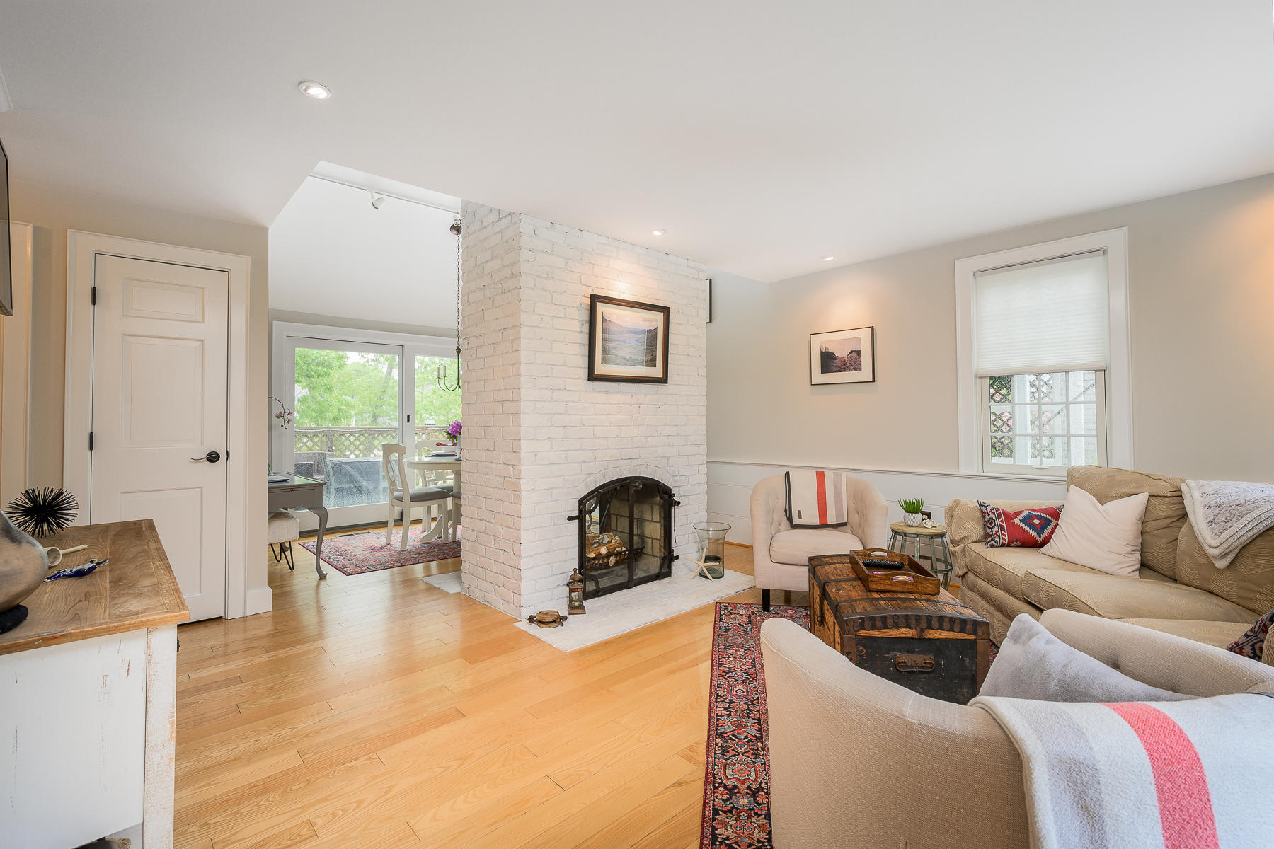20 Squirrel Run Eastham, MA 02642 - Photo 10 of 37 a living room with furniture and a fireplace