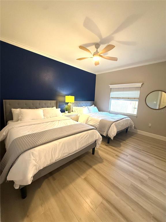 423 150th Avenue, Unit 1405 Madeira Beach, FL 33708 - Photo 11 of 23 a bedroom with bed and window