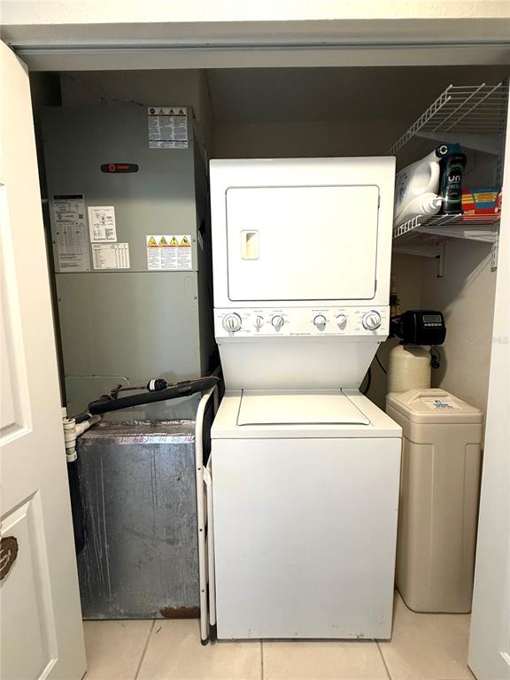 423 150th Avenue, Unit 1405 Madeira Beach, FL 33708 - Photo 19 of 23 a utility room with dryer and washer