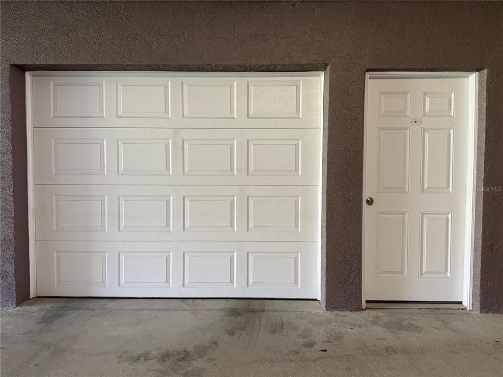 423 150th Avenue, Unit 1405 Madeira Beach, FL 33708 - Photo 20 of 23 an empty room with white door