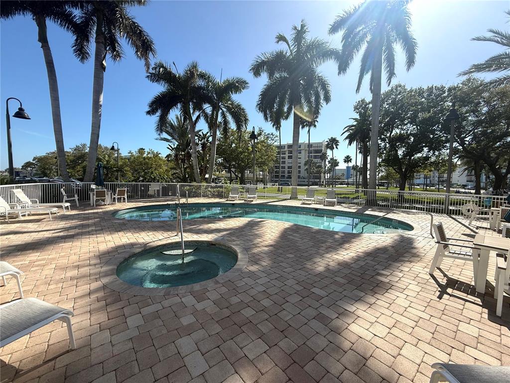 423 150th Avenue, Unit 1405 Madeira Beach, FL 33708 - Photo 22 of 23 a view of a water fountain with palm trees