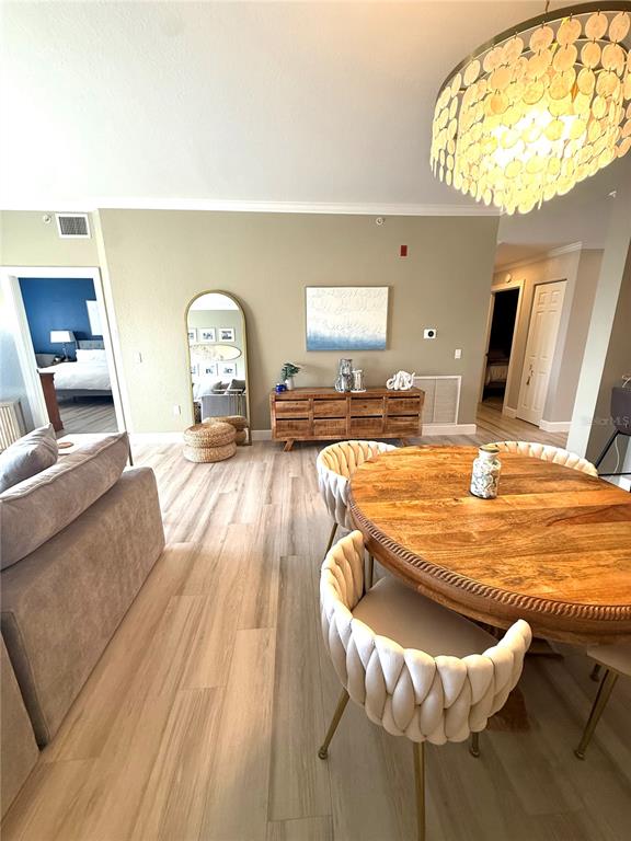 423 150th Avenue, Unit 1405 Madeira Beach, FL 33708 - Photo 8 of 23 a living room with a couch and a table