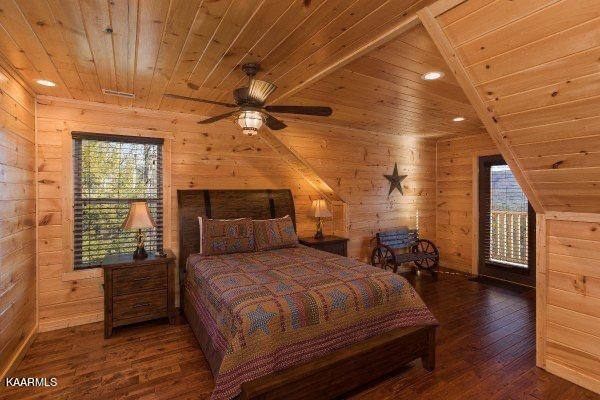 1857 Pinestand Rdg Way Pigeon Forge, TN 37862 - Photo 12 of 49 a bedroom with a bed and wooden floor