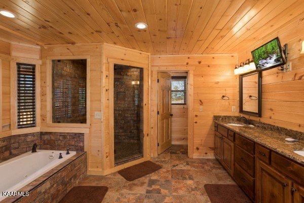 1857 Pinestand Rdg Way Pigeon Forge, TN 37862 - Photo 24 of 49 a spacious bathroom with a granite countertop sink and a bathtub