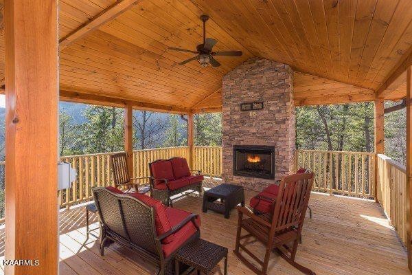 1857 Pinestand Rdg Way Pigeon Forge, TN 37862 - Photo 34 of 49 a outdoor space with patio fireplace furniture and wooden floor