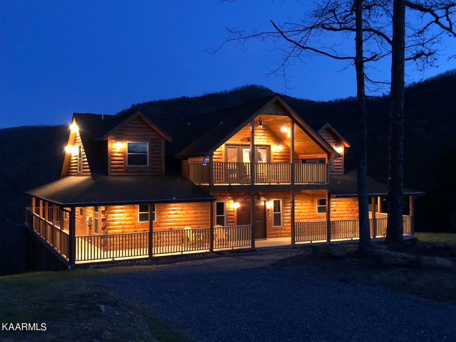 1857 Pinestand Rdg Way Pigeon Forge, TN 37862 - Photo 47 of 49 a view of an empty room with a wooden floor and windows
