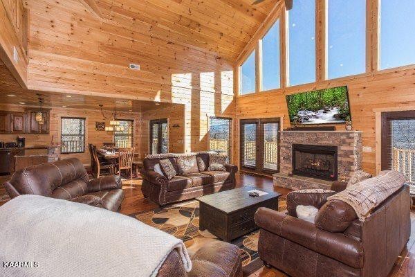 1857 Pinestand Rdg Way Pigeon Forge, TN 37862 - Photo 5 of 49 a living room with furniture a fireplace and windows