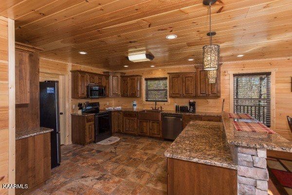 1857 Pinestand Rdg Way Pigeon Forge, TN 37862 - Photo 7 of 49 a large kitchen with kitchen island a large counter top stainless steel appliances and cabinets