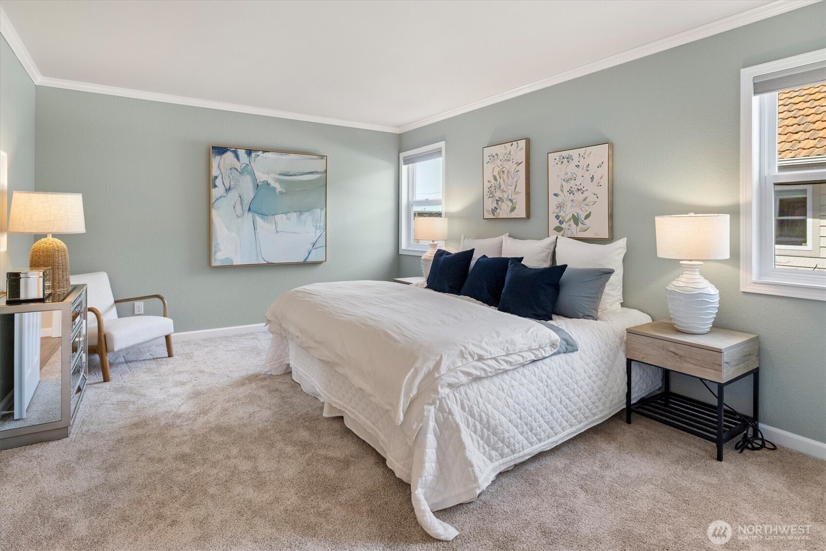 317 3rd Avenue South, Unit 201 Edmonds, WA 98020 - Photo 17 of 39 a bedroom with a bed and a lamp on table