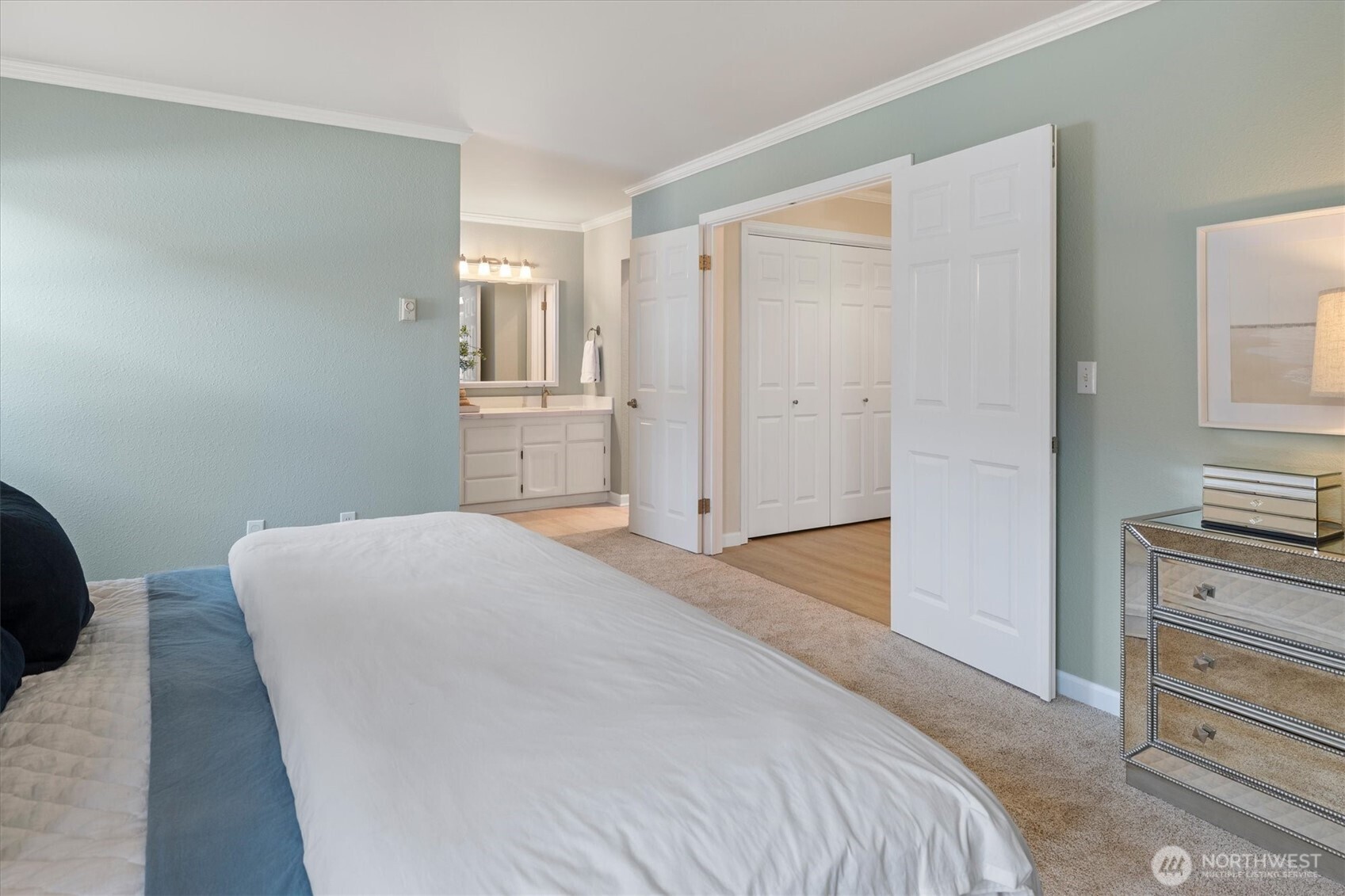 317 3rd Avenue South, Unit 201 Edmonds, WA 98020 - Photo 18 of 39 a bedroom with a bed and a dresser