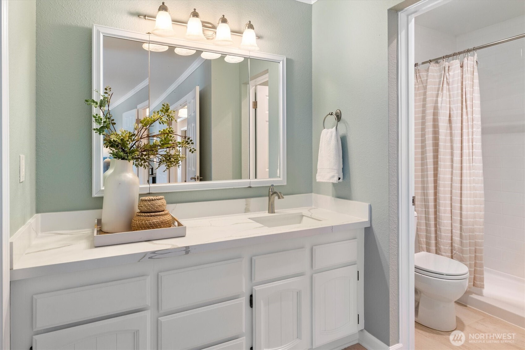 317 3rd Avenue South, Unit 201 Edmonds, WA 98020 - Photo 19 of 39 a bathroom with a sink and a mirror with toilet