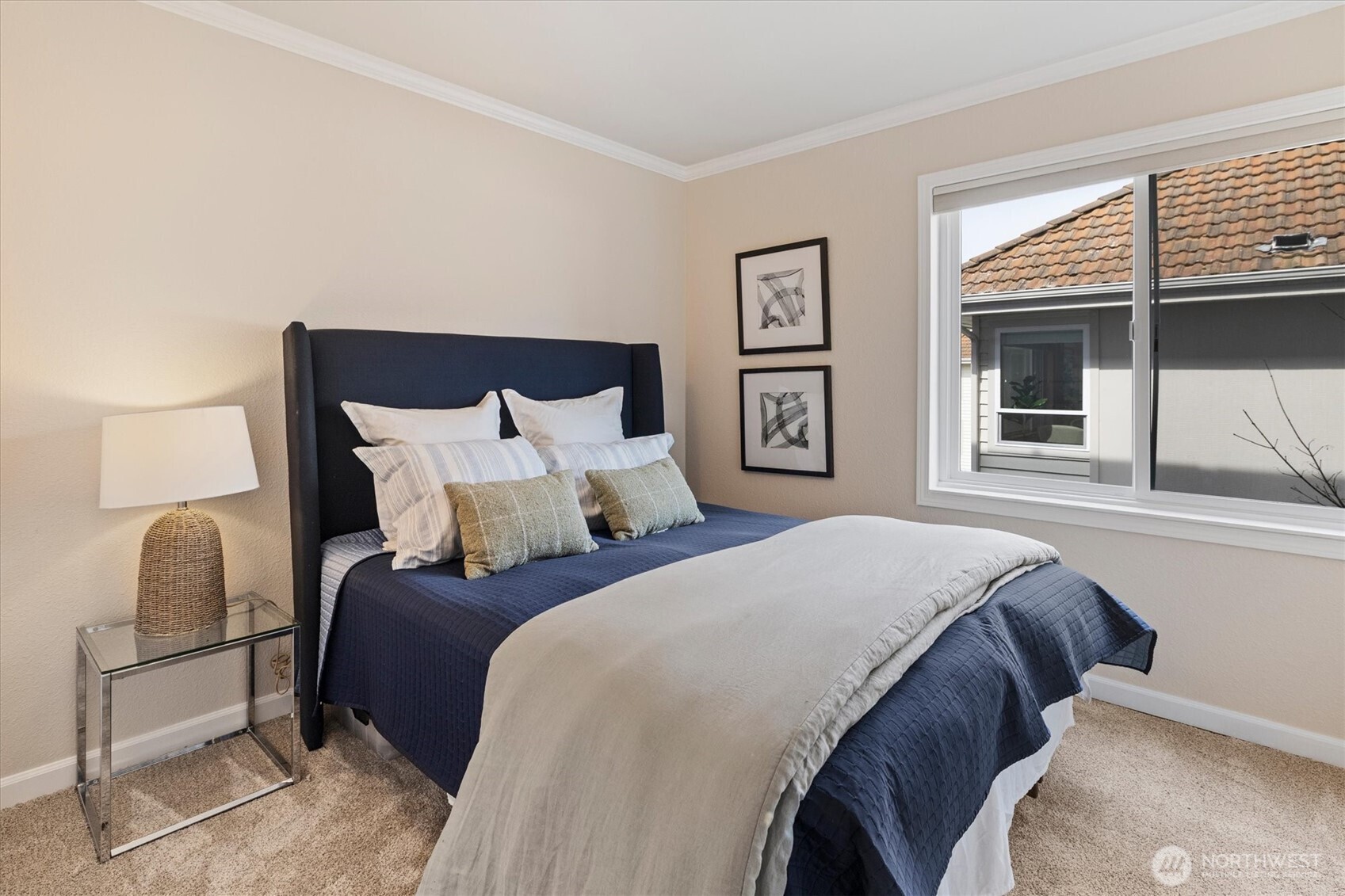 317 3rd Avenue South, Unit 201 Edmonds, WA 98020 - Photo 21 of 39 a bedroom with a bed and window