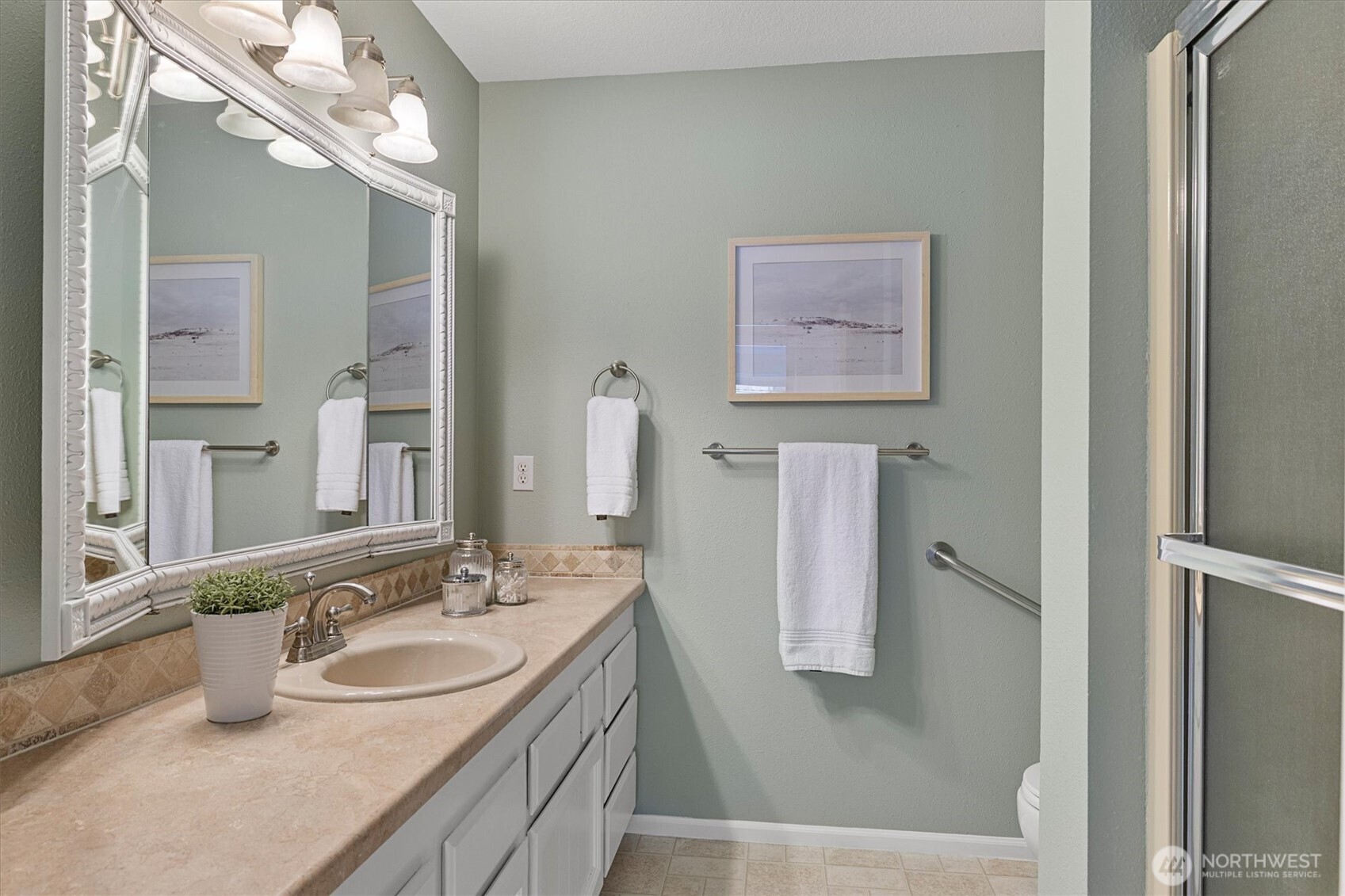 317 3rd Avenue South, Unit 201 Edmonds, WA 98020 - Photo 22 of 39 a bathroom with a sink and a mirror