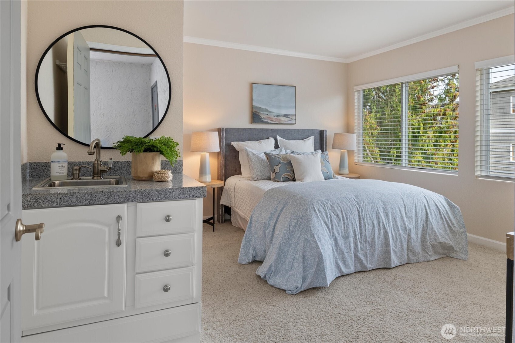 317 3rd Avenue South, Unit 201 Edmonds, WA 98020 - Photo 26 of 39 a bedroom with bed and a mirror