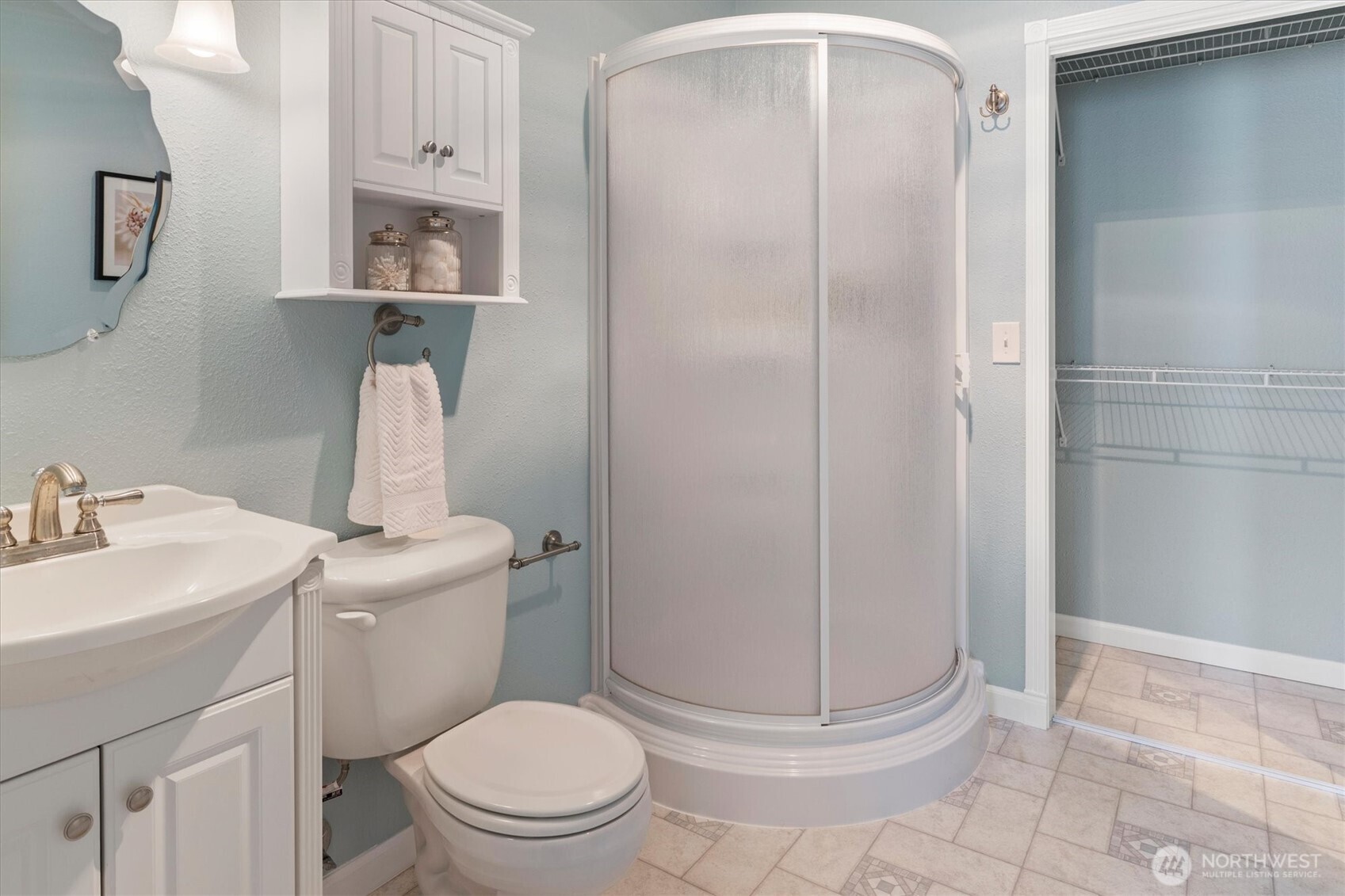 317 3rd Avenue South, Unit 201 Edmonds, WA 98020 - Photo 28 of 39 a bathroom with a toilet a sink and shower