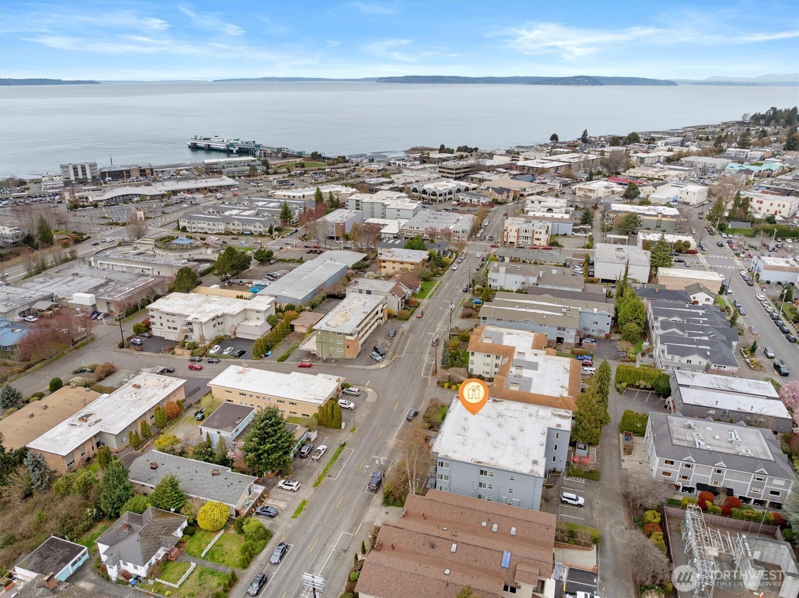 317 3rd Avenue South, Unit 201 Edmonds, WA 98020 - Photo 34 of 39 an aerial view of a city with lots of residential buildings and ocean view in back