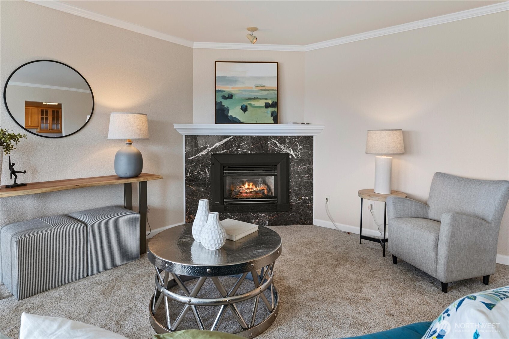 317 3rd Avenue South, Unit 201 Edmonds, WA 98020 - Photo 4 of 39 a living room with furniture and a fireplace