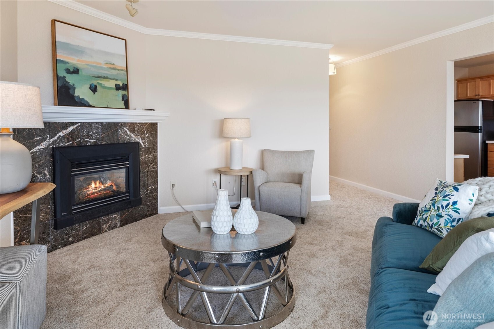 317 3rd Avenue South, Unit 201 Edmonds, WA 98020 - Photo 5 of 39 a living room with furniture and a fireplace