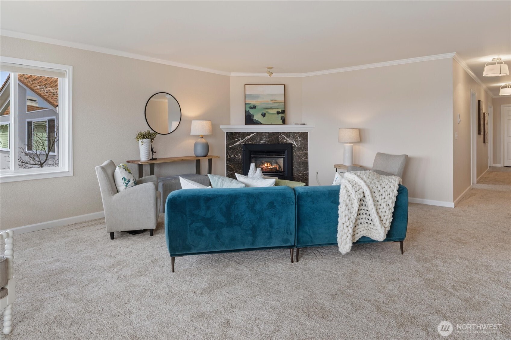 317 3rd Avenue South, Unit 201 Edmonds, WA 98020 - Photo 6 of 39 a living room with furniture and a fireplace