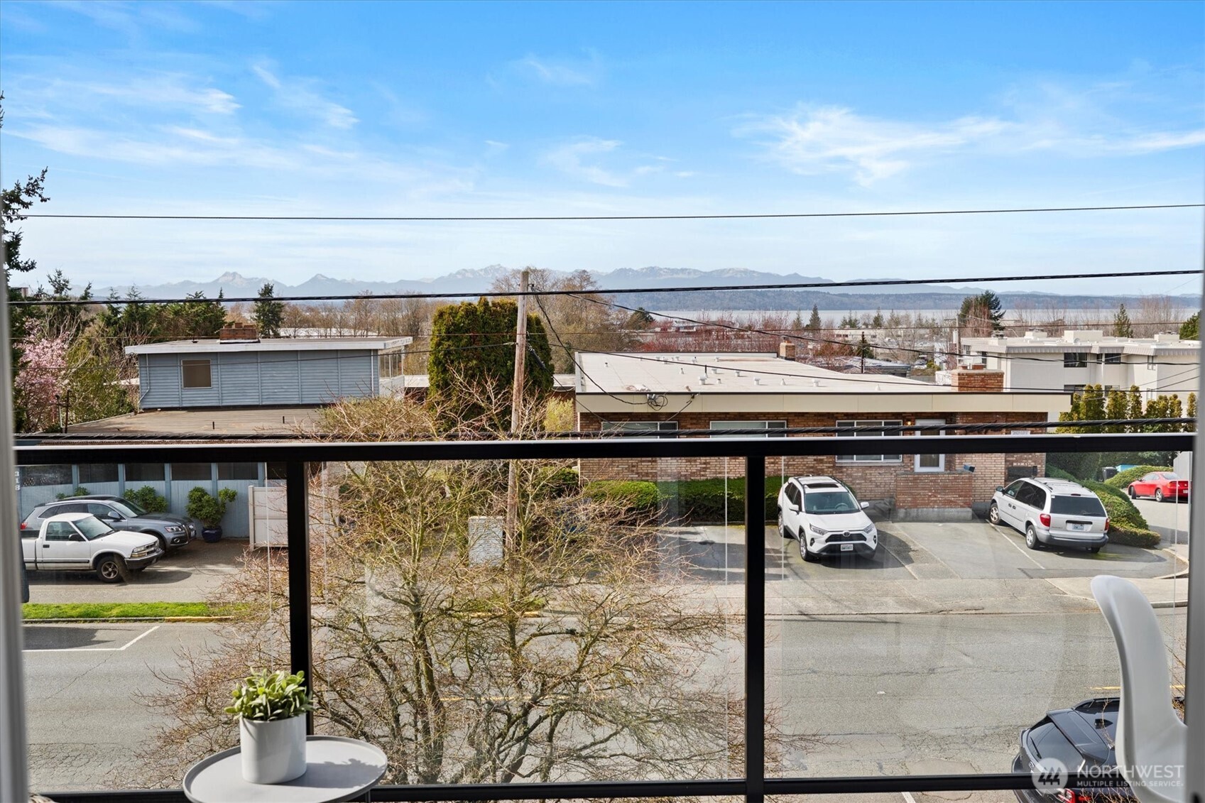317 3rd Avenue South, Unit 201 Edmonds, WA 98020 - Photo 10 of 39 a view of a balcony with chair and table