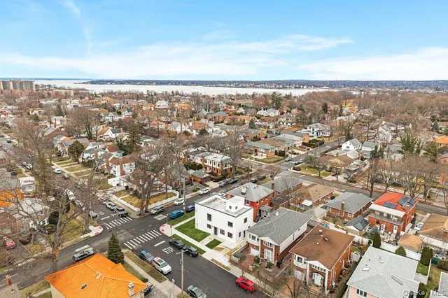 an aerial view of residential building with yard