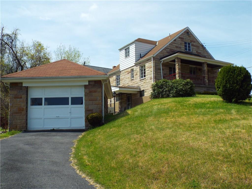 1900 Ridge Avenue Coraopolis, PA 15108 - Photo 3 of 24 Detached one car stone garage with rear door leading to door to finished lower level gameroom.