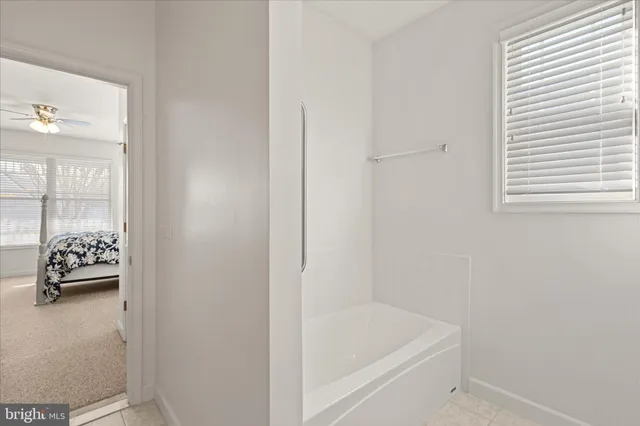 a bathroom with a sink a mirror and vanity