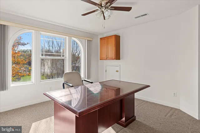 a room with a table and chairs