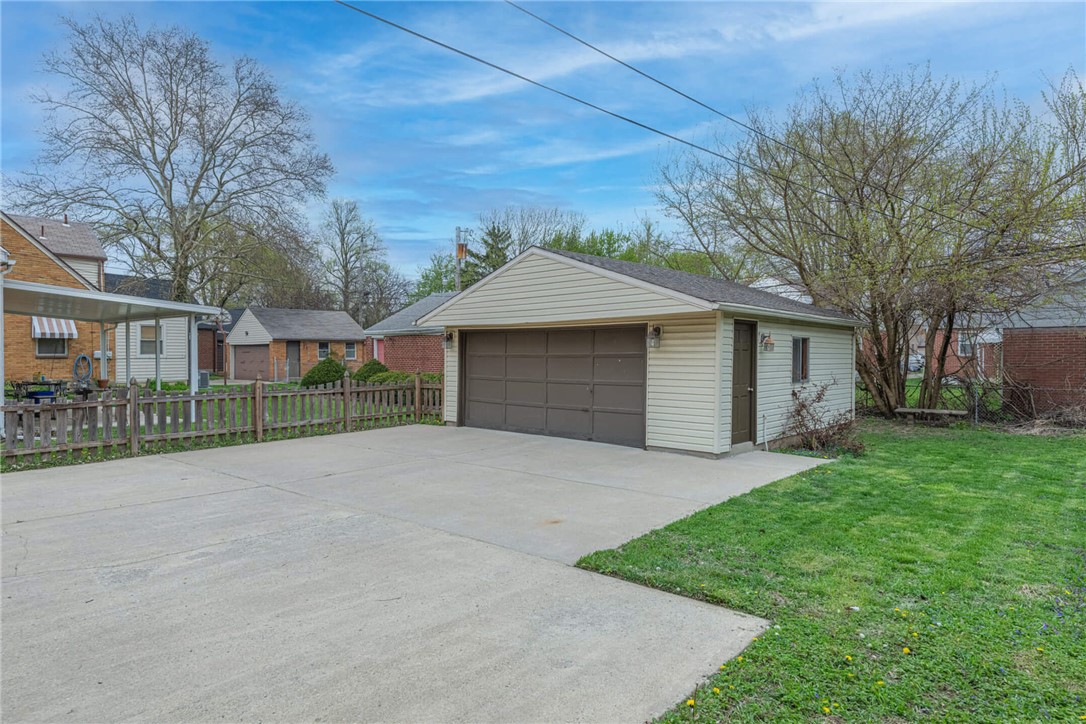 1012 Hampshire Road Dayton, OH 45419 - Photo 35 of 39 This spacious garage and driveway offer ample parking and storage options.