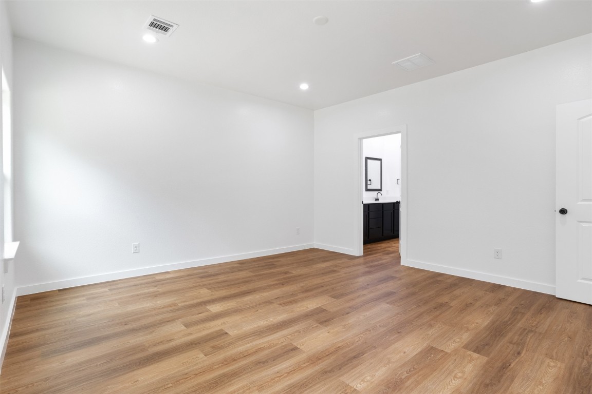 14390 Half Circle Splendora, TX 77372 - Photo 14 of 27 a view of empty room with wooden floor and window