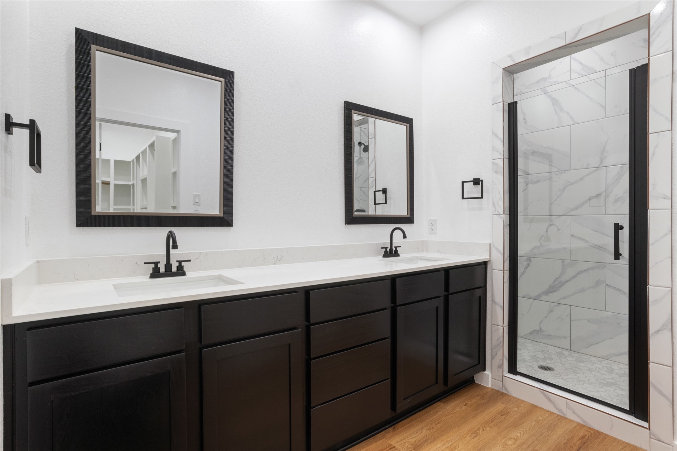 14390 Half Circle Splendora, TX 77372 - Photo 15 of 27 a bathroom with a double vanity sink mirror and shower