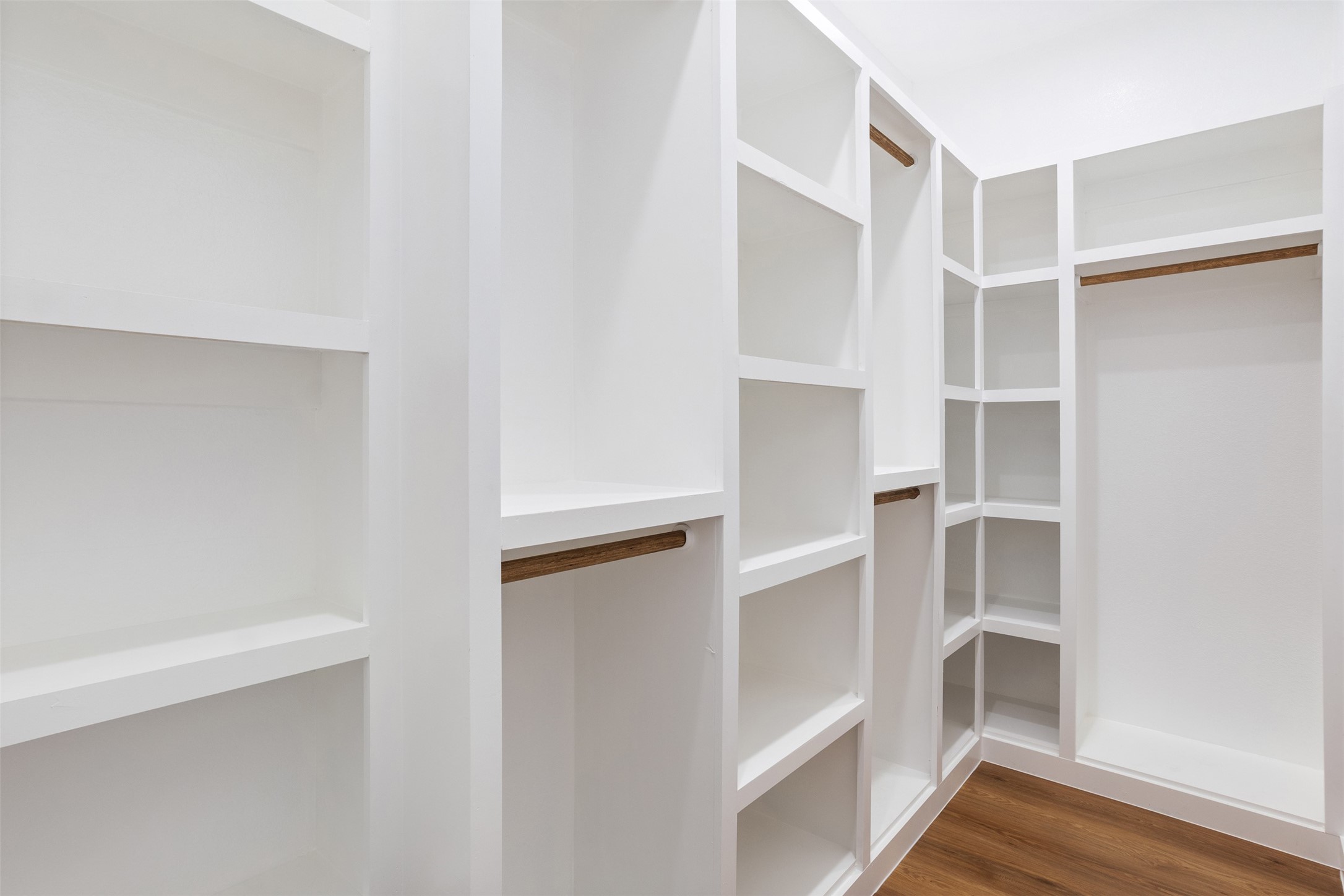 14390 Half Circle Splendora, TX 77372 - Photo 16 of 27 a view of walk in closet with empty racks