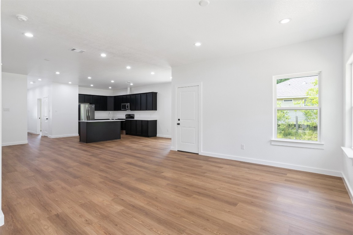 14390 Half Circle Splendora, TX 77372 - Photo 24 of 27 a view of kitchen with stainless steel appliances wooden floor and large window