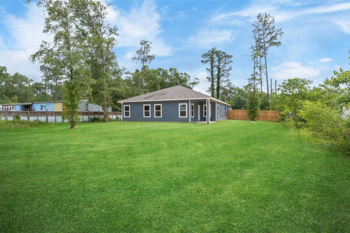 14390 Half Circle Splendora, TX 77372 - Photo 6 of 27 a front view of a house with garden