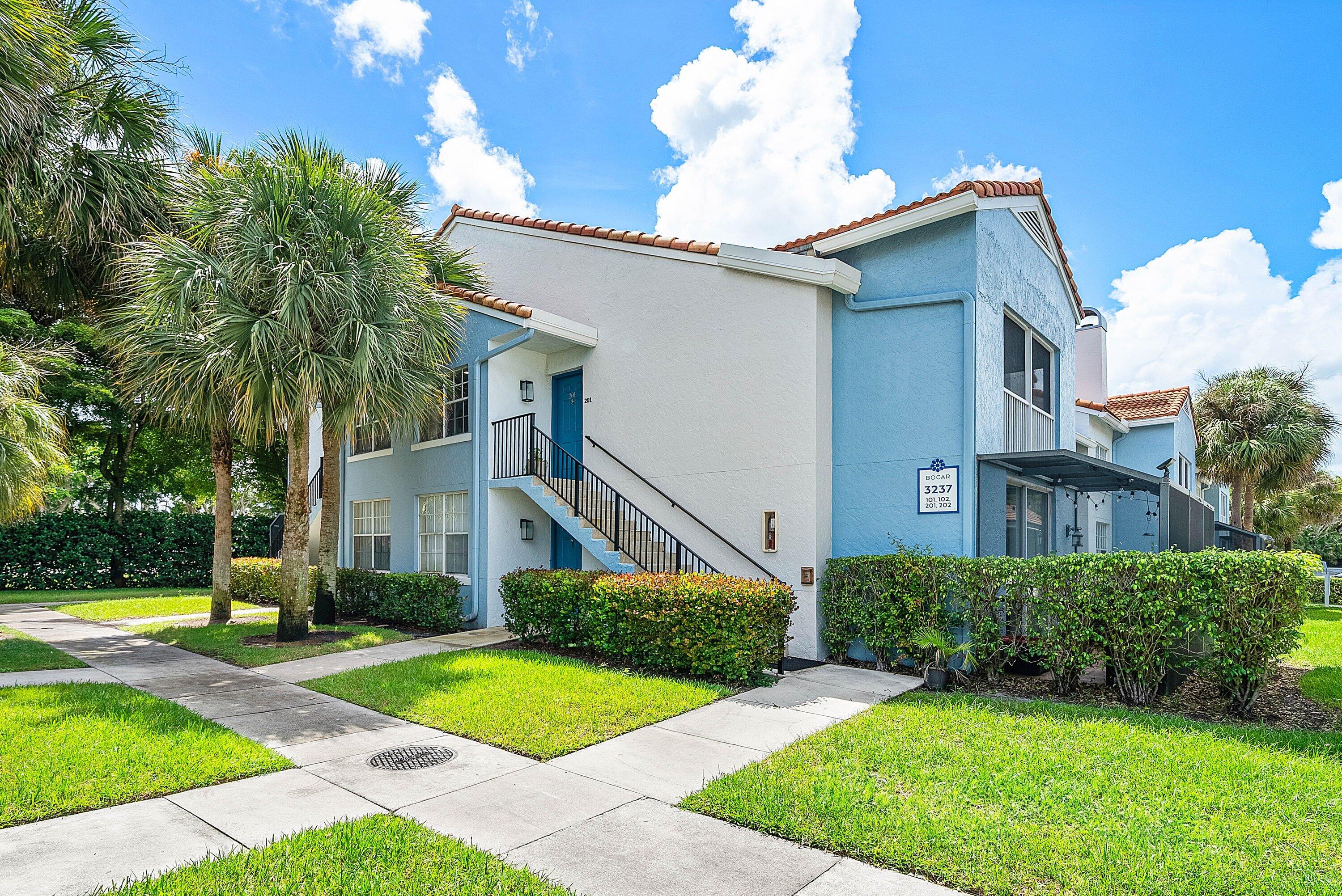 Undisclosed Address Boca Raton, FL 33496 - Photo 1 of 46 a view of a house with a yard and potted plants