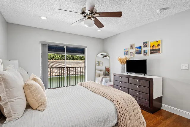 a bedroom with a bed and a tv