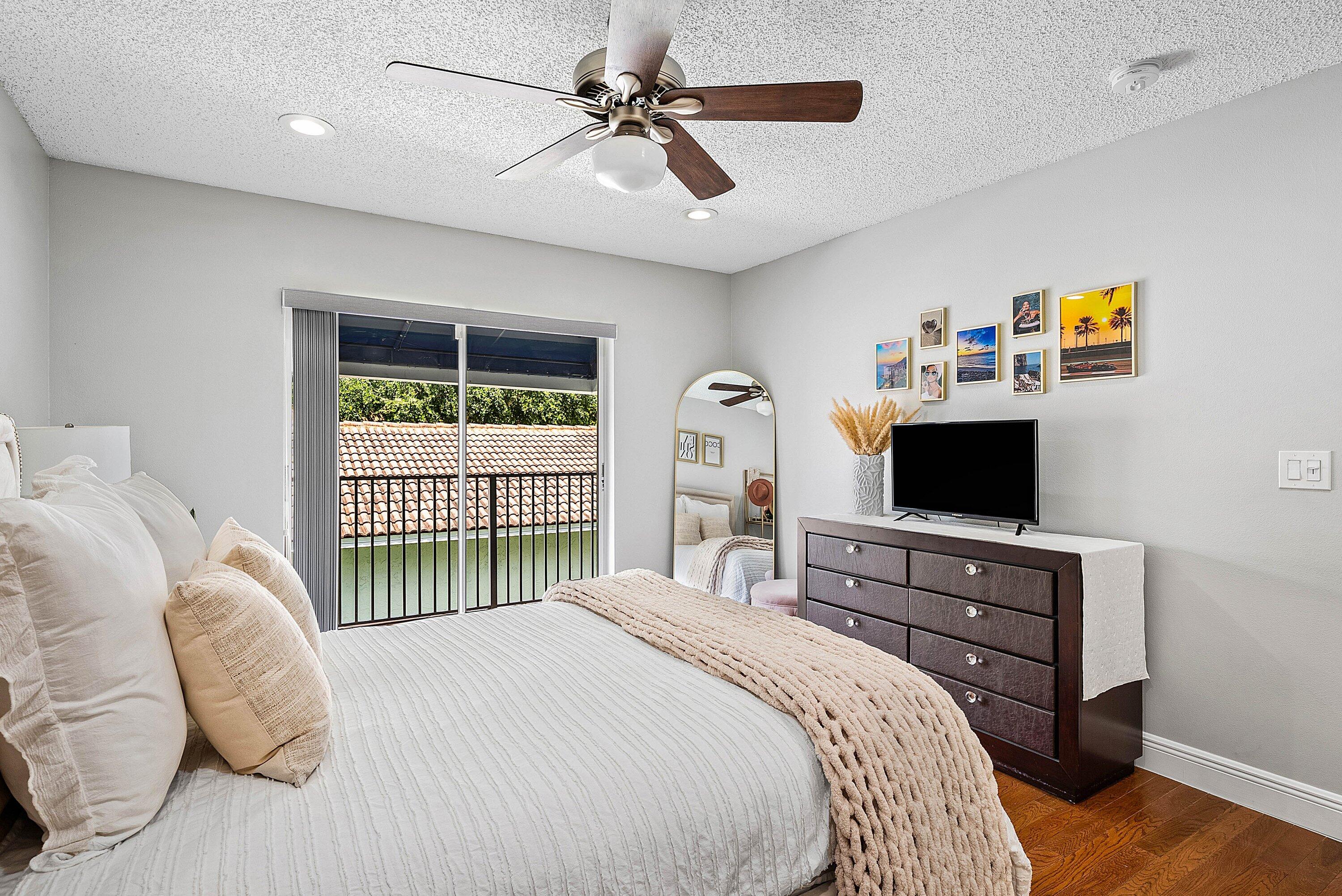 Undisclosed Address Boca Raton, FL 33496 - Photo 16 of 46 a bedroom with a bed and a tv