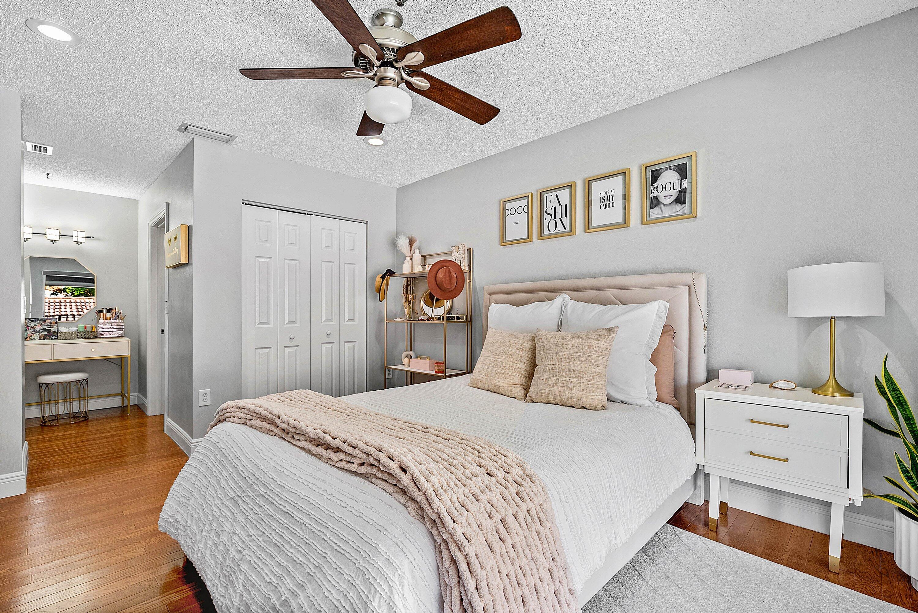 Undisclosed Address Boca Raton, FL 33496 - Photo 17 of 46 a bedroom with a bed and a chandelier