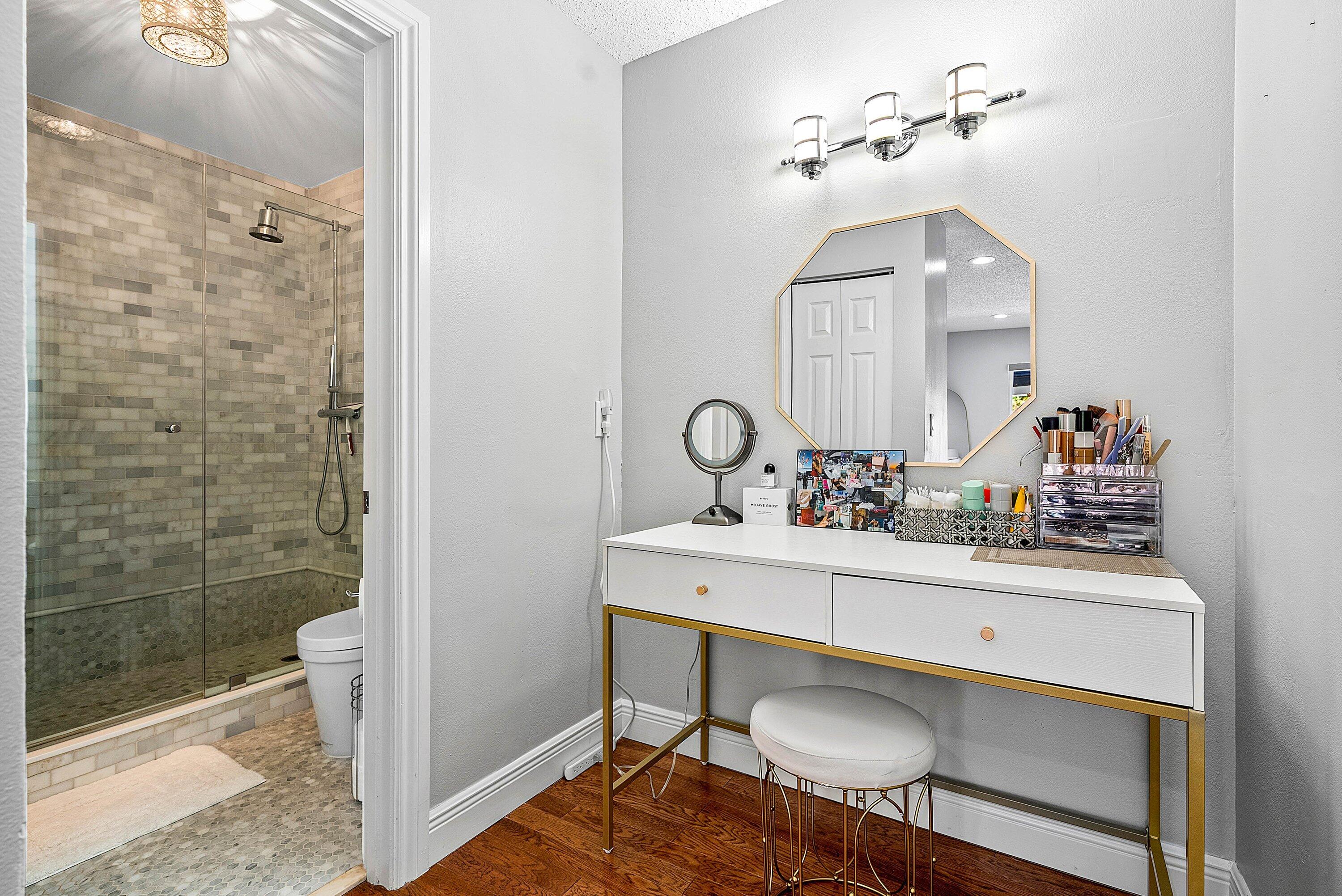 Undisclosed Address Boca Raton, FL 33496 - Photo 18 of 46 a bathroom with a sink a toilet and shower