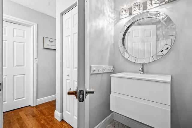 a room with a sink and a mirror