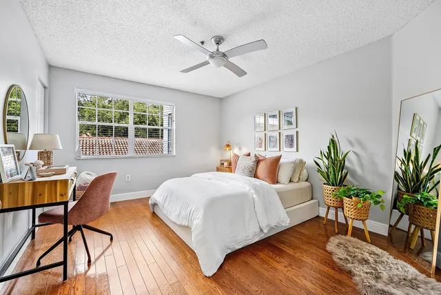 a bedroom with a bed and a table